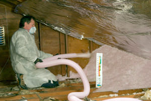 Fiberglass Insulation being used to add energy efficiency to an attic in Auburn