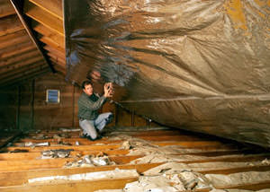 A radiant barrier installed in a Lansing attic