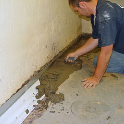 Testing a French drain system in a Geneva home.