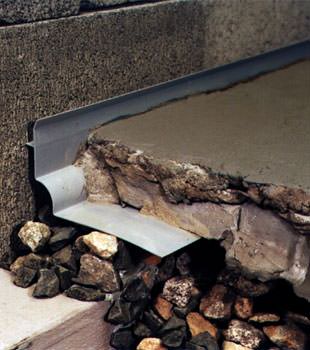 a custom designed basement drain system for thin basement floors in Victor.