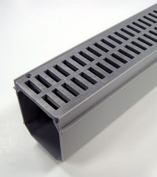 A closeup of our grated basement drainage pipe system, installed in Oneida