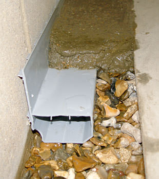 A basement drain system installed in a Fairport home