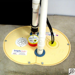 A sump pump system installed along a basement floor in Rochester.