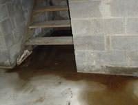 Water Pouring into a Geneva Basement through Hatchway Doors