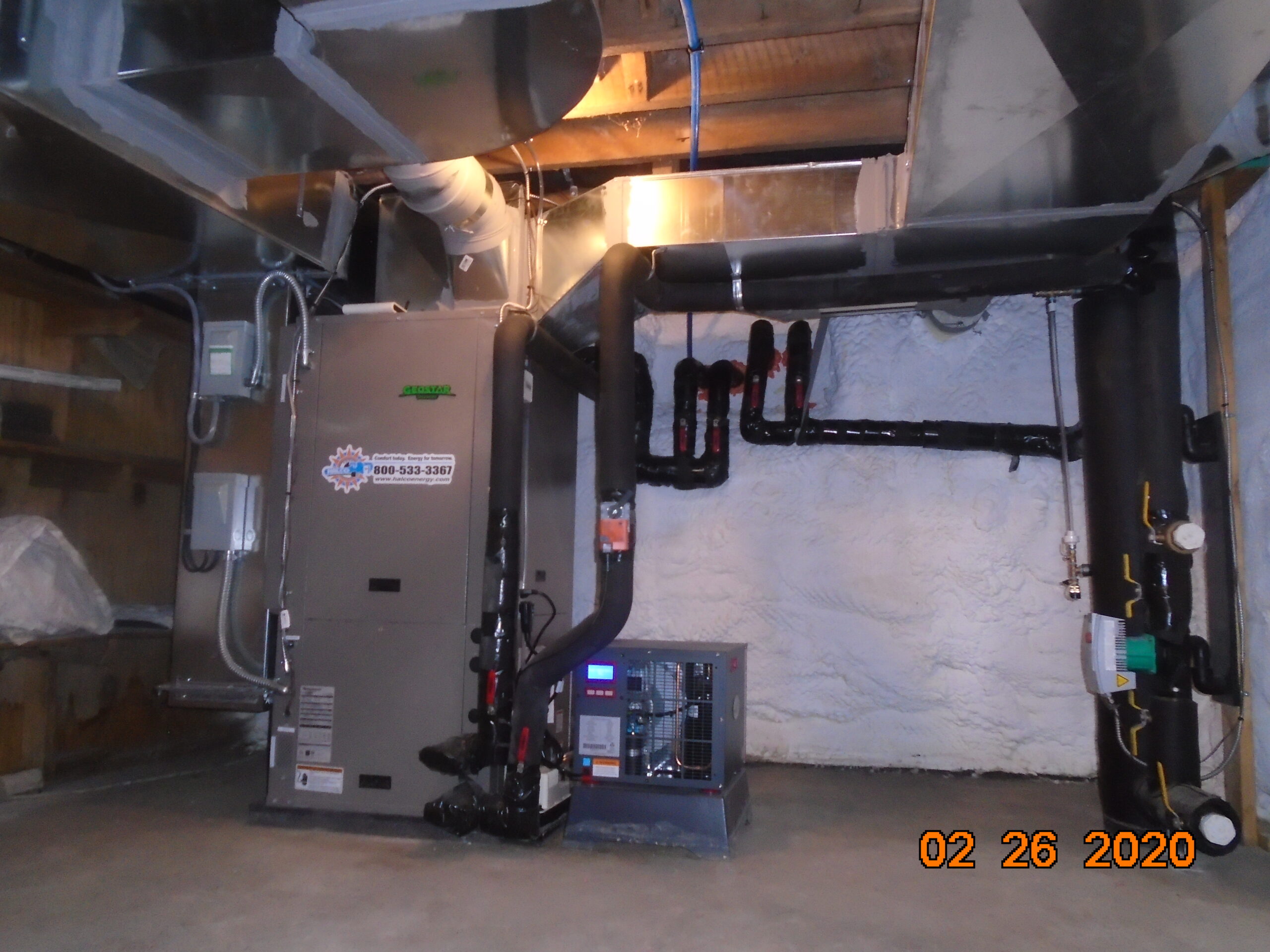 Pictured here is the third geothermal heat pump that heats the 1st floor of the home. You'll also notice a SaniDry dehumidifier to the right... this will help keep the basement nice and dry.