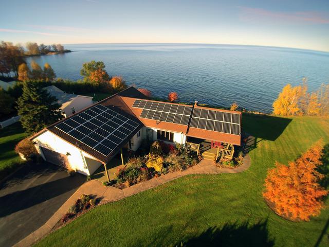 home in new york with solar panels on the roof