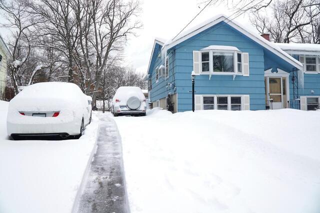 home with snow all over it